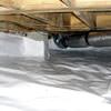 Bare floor joists in a sealed, insulated crawl space in Salinas.