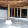 A large, encapsulated crawl space with our vapor barrier system installed in Hayward.