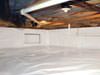 A crawl space moisture barrier installed in California