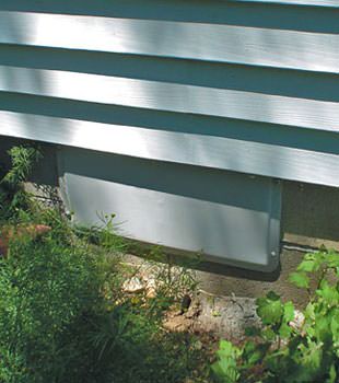 A gray crawl space vent cover in Modesto